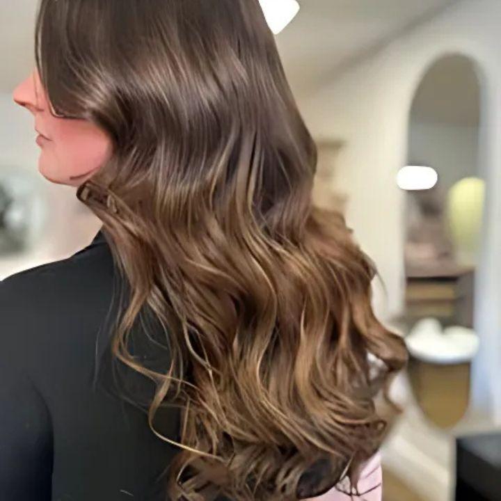 Brunette wavy hair extensions by Astair Organic Hair