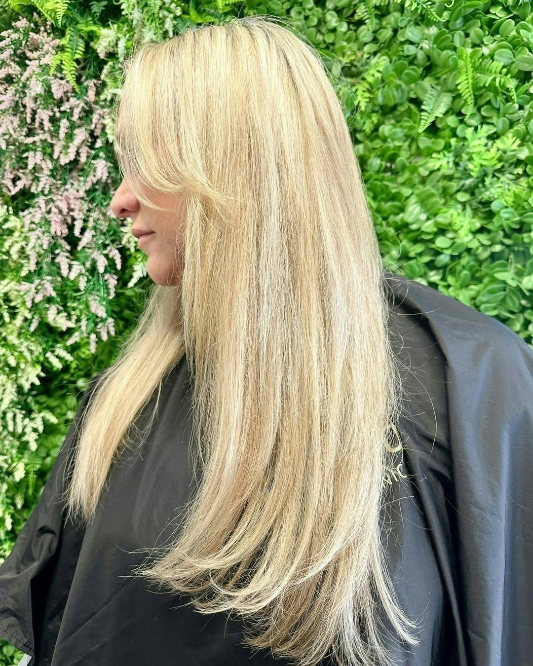 Long blonde hair extensions styled in the Dunsborough salon