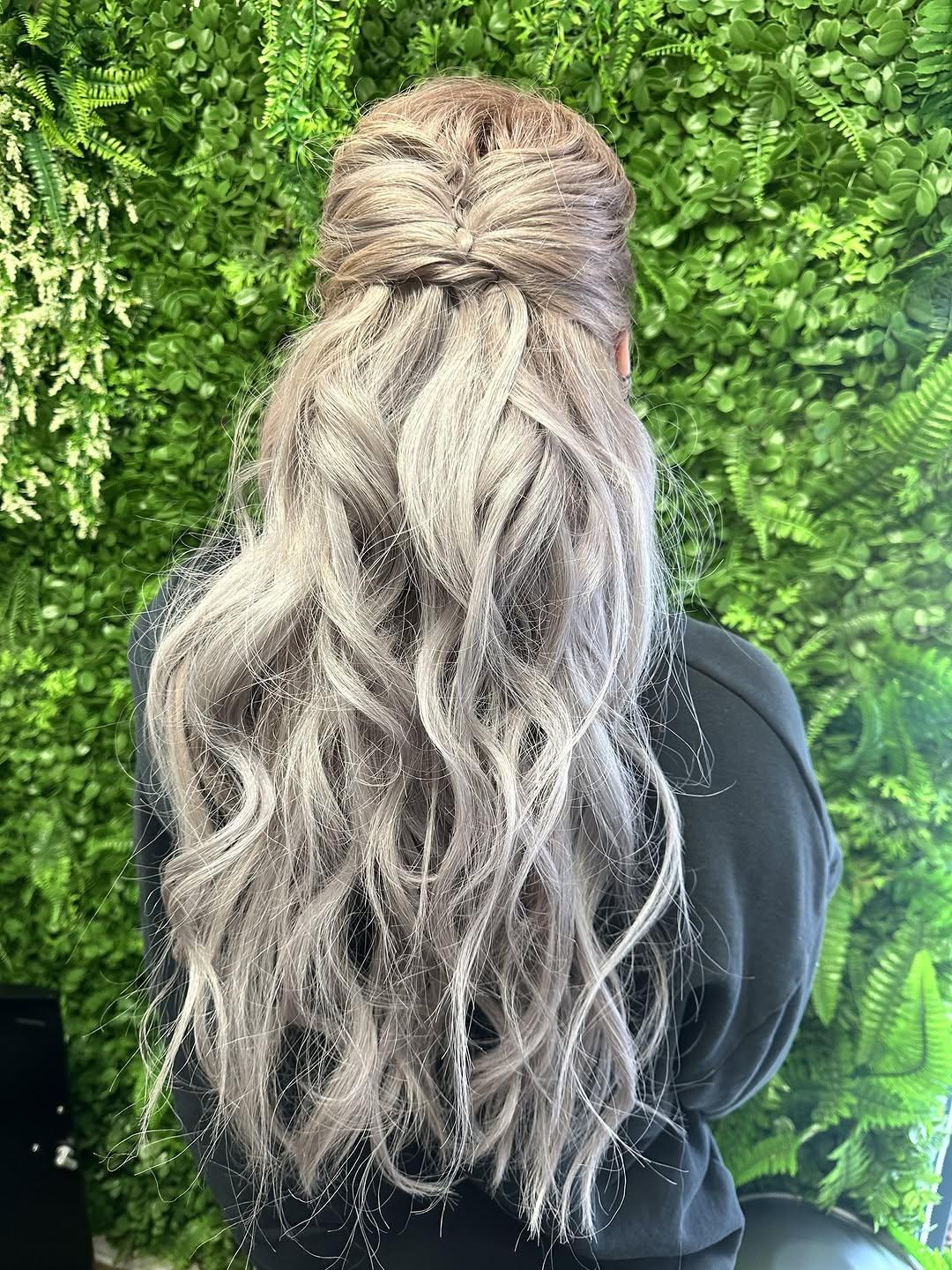Silver hair extensions blended through long layers