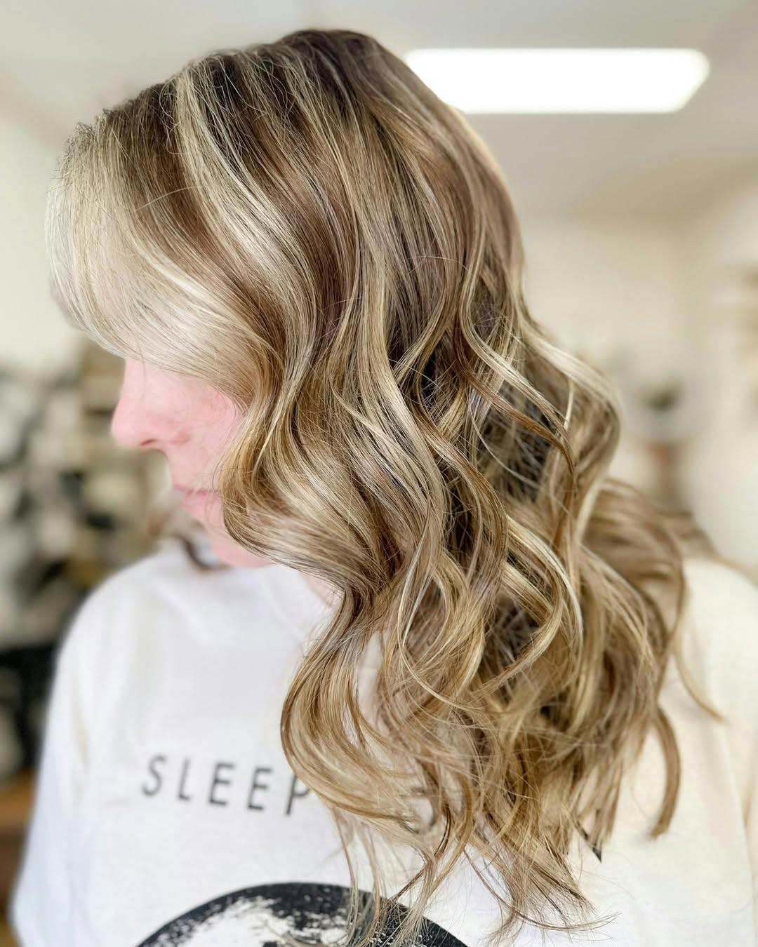 Dimensional balayage with soft curls by Astair Organic Hair